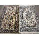 TWO EASTERN PERSIAN STYLE PATTERNED CARPETS in colourful and light muted tones and traditional