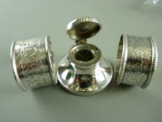 A SMALL SILVER CAPSTAN INKWELL, Birmingham 1924 and two silver napkin rings, one Chester 1903,