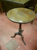 AN EARLY VICTORIAN MAHOGANY TILT TOP TRIPOD TABLE, the 46 cms diameter top on a turned column and