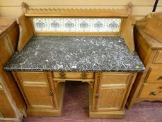 AN ARTS & CRAFTS PUGIN INFLUENCED WASHSTAND, the castellated top splashback with carved finial