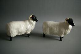 A PAIR OF BESWICK POTTERY BLACK FACED SHEEP nos. 1765