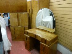 AN ART DECO THREE PIECE WALNUT BEDROOM SUITE with headboard, comprising double door wardrobe and