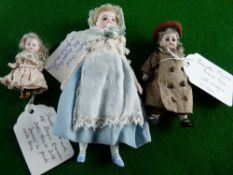 A GROUP OF THREE MINIATURE BISQUE HEADED DOLLS, all in contemporaneous clothing - 1. a bisque headed