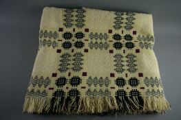 A LARGE VINTAGE WELSH WOOLLEN BLANKET, traditional pattern in cream and purple tones