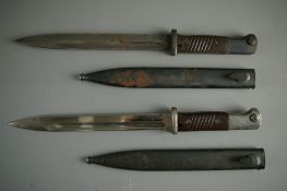TWO GERMAN MAUSER BAYONETS both with scabbard, one stamped 'S/240', no. 1493, the scabbard