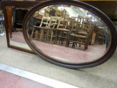 A MAHOGANY OVAL MANTEL MIRROR with Greek Key top detail and an oval framed wall mirror, both with