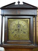 AN OAK & BRASS DIAL LONGCASE CLOCK, the dial marked 'Owen, Llanrwst', single door square hood with