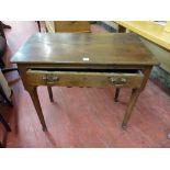 AN ANTIQUE OAK SINGLE DRAWER SIDE TABLE, rectangular topped on circular tapering supports, detail to
