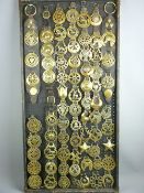 SHIRE/HEAVY HORSE BRASSWARE - a 4ft display board containing sixty plus pierced brasses, both