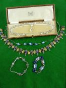 THREE VINTAGE NECKLACES & TWO BRACELETS including a gilt mask and white metal shield example, one of