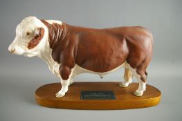 A BESWICK POTTERY MATT FINISH STANDING POLLED HEREFORD BULL from 'The Connoisseur Series', on an