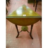 AN EDWARDIAN MAHOGANY TRIPLE FLAP TRIANGULAR SIDE TABLE on three turned and swept supports with