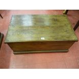 AN ANTIQUE OAK LIDDED BOX with interior candle tray and iron strap hinges, 34 cms high, 78.5 cms