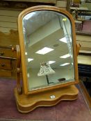 A VICTORIAN SWING DRESSING MIRROR with shaped base on bun feet