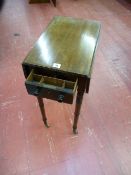 A NEAT REGENCY MAHOGANY TWIN FLAP SIDE TABLE with end drawer, having turned wooden knobs and
