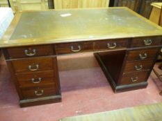 A LARGE TWIN PEDESTAL MAHOGANY DESK, the top with tooled leather insert with three frieze drawers