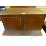 A 19th CENTURY TWO DOOR TABLE CABINET with boxwood string inlay and interior shelf, 33.25 cms