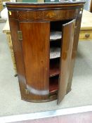 A GEORGIAN INLAID MAHOGANY WALL HANGING CORNER CUPBOARD with Sheraton shell inlay frieze panel above