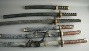 TWO SETS OF THREE JAPANESE SAMURAI STYLE SWORDS (modern reproduction display items), varying