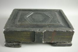 A VICTORIAN SLATE DOORSTOP fashioned as a book/family Bible with clasp, on corner supports, 26.5 x