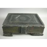 A VICTORIAN SLATE DOORSTOP fashioned as a book/family Bible with clasp, on corner supports, 26.5 x