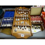 Quantity of collector's spoons and displays along with two cased sets