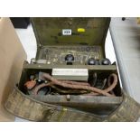 Army field telephone in a metal carrying case