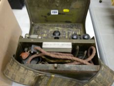Army field telephone in a metal carrying case