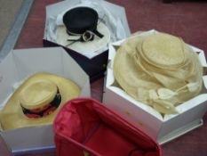 Three lady's stylish hats in boxes, marked 'Jaeger' etc and a pink holdall