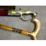 Ornamental sword with lion handle and scabbard and a walking stick
