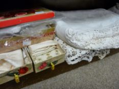 Large linen lace edged cloth and a vintage Terry's chocolate box containing various handkerchiefs
