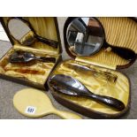 Ivorine hand mirror and two cased mirror and brush sets