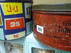 Two vintage sweet tins, one for 'Cadbury's Lucky Numbers' and 'Lovell's Toffee Rex'
