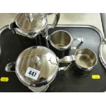 Stainless steel four piece teaset on a twin handled tray