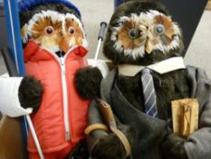 'The London Owl Company' two figures dressed as a businessman and a skier