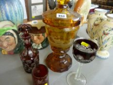 Bohemian facet cut amber glass and etched vase and cover and three item of ruby glassware