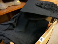 Graduation hat by Ravenscroft of London and a gown