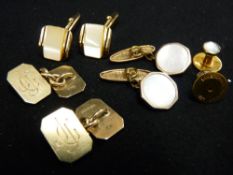 Pair of oblong nine carat gold cufflinks with canted corners, initialled 'J G J', 12.5 grms, another