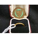 Twenty two carat gold narrow wedding band and an Urdd brooch