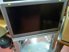 Neat Toshiba flatscreen TV on integrated stand with remote control E/T