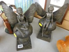 Two bronze effect fairy figurines on toadstools by Ronald Moll