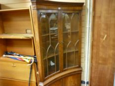 Concave floorstanding corner cupboard with upper glazed doors