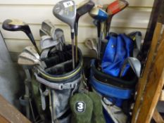 Two golf bags, trolley and large assortment of clubs