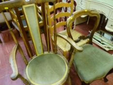 Cane seated ladderback chair, circular seated Windsor style elbow chair and a balloon backed