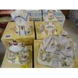 Four boxed Coalport cottages