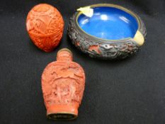 Three carved cinnabar style decorative items