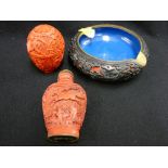 Three carved cinnabar style decorative items