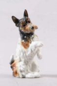 Porzellanfigur.Ens - Volkstedt, um 1930/40. Sitzender Terrier. H: 22 cm. Best. 20.00 % buyer's