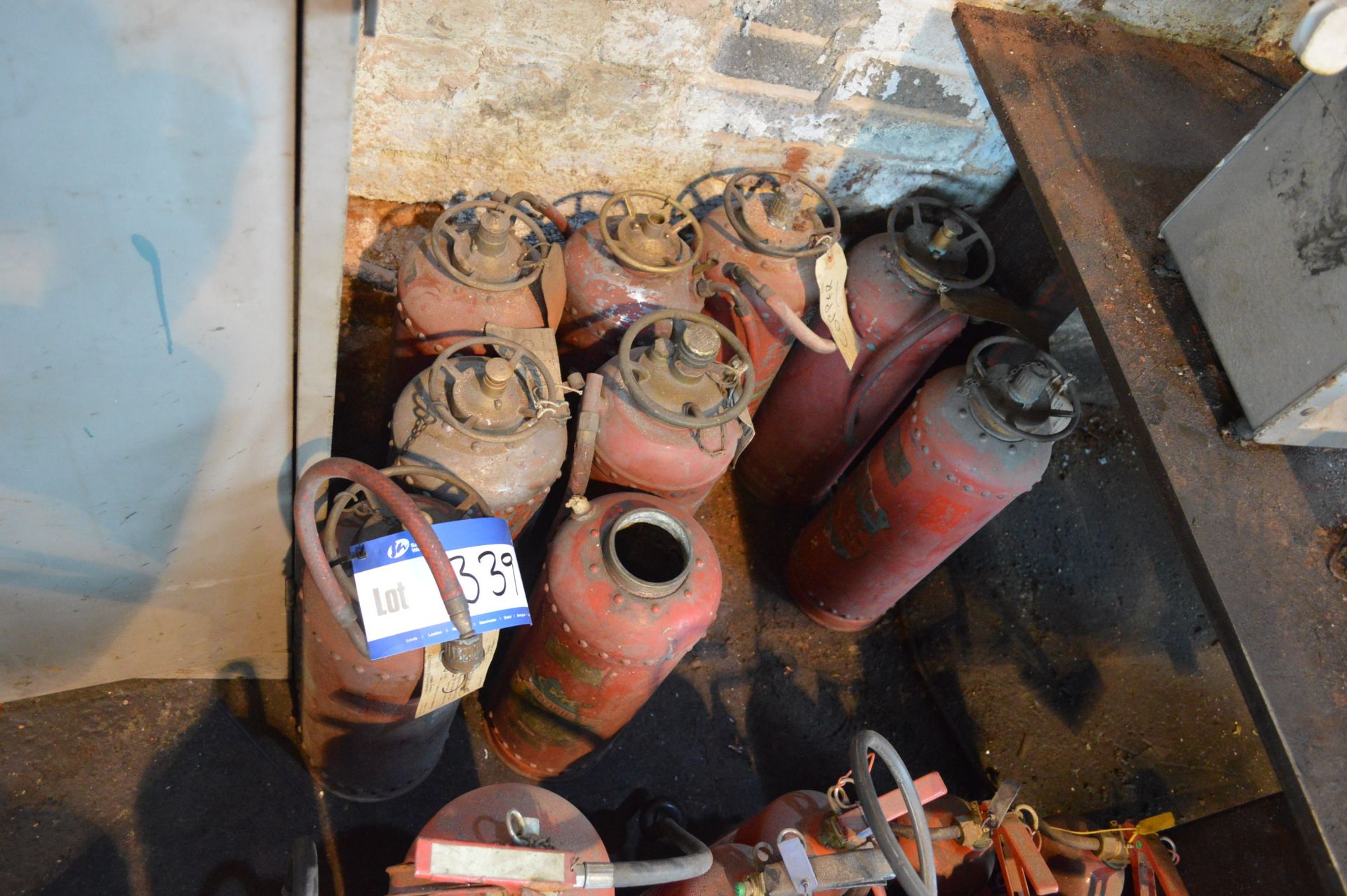 Nine Copper Fire Extinguishers