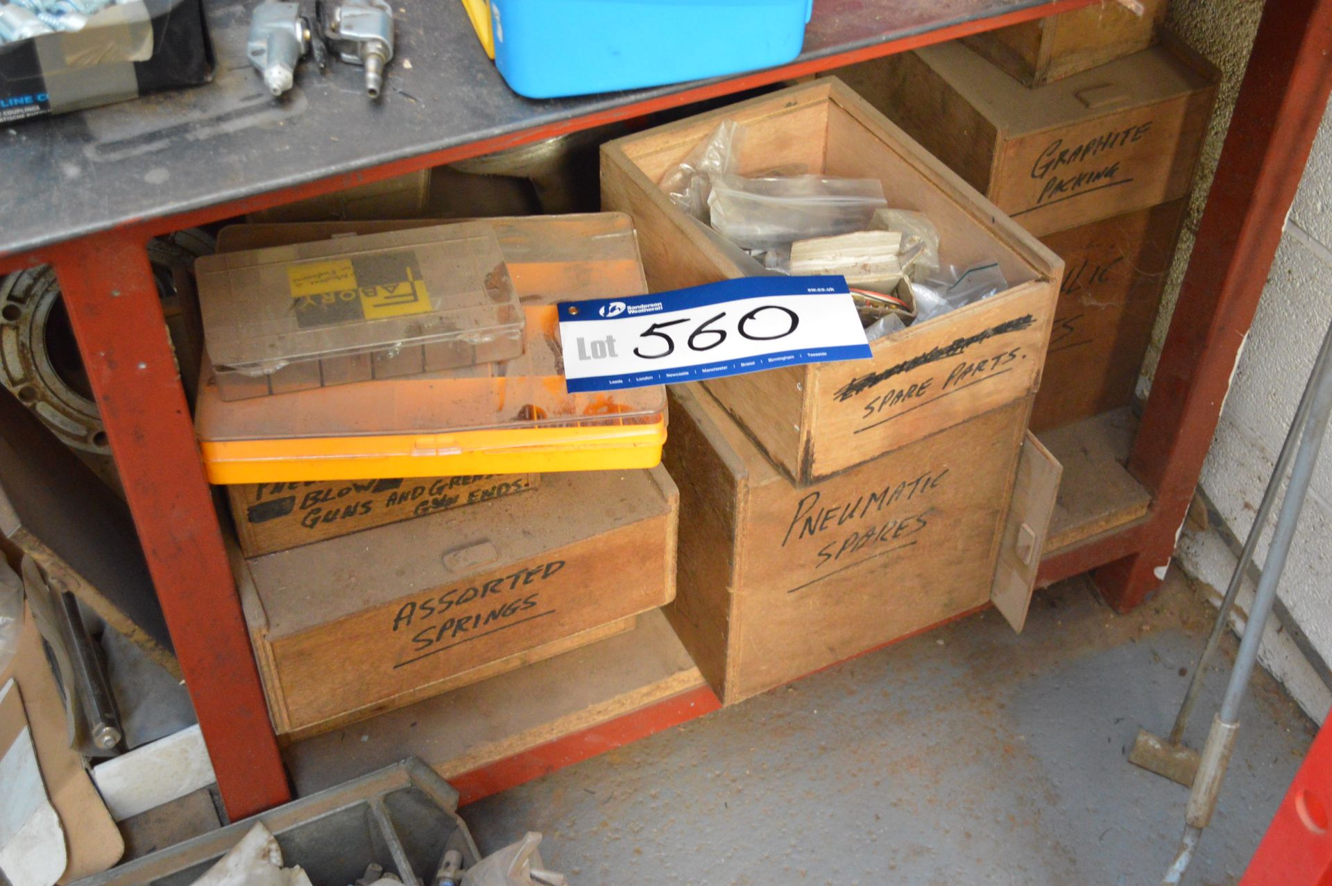 Boxes and Contents, on bottom shelf of steel bench